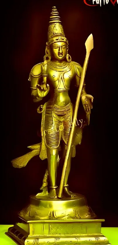 Golden statue wallpaper with intricate spiritual design, ideal for mobile screens.