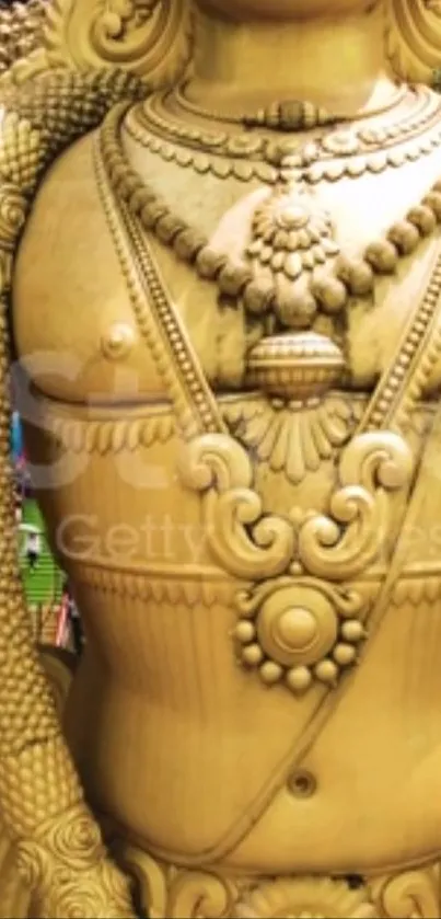 Golden Hindu statue showing intricate artwork.