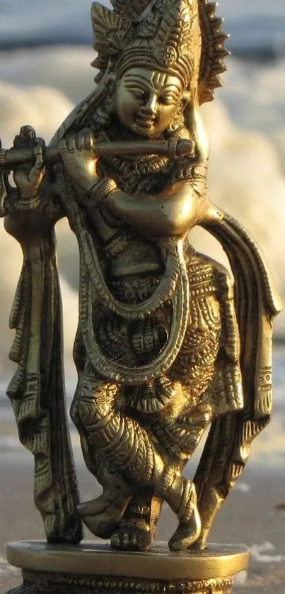 Golden statue of Krishna playing a flute on a serene background.