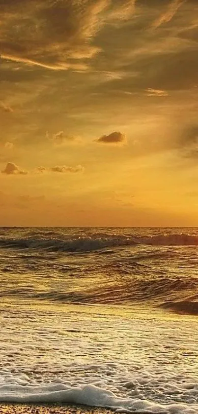 Golden sunset over ocean waves at a serene beach.