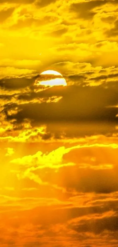 Golden sunset behind clouds wallpaper, vibrant and serene.