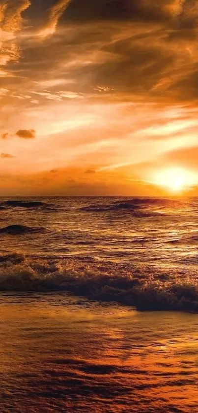 Golden sunset over ocean waves wallpaper.