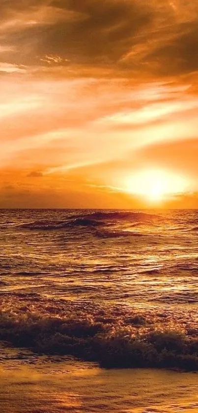 Golden sunset over the ocean with serene waves and warm sky.