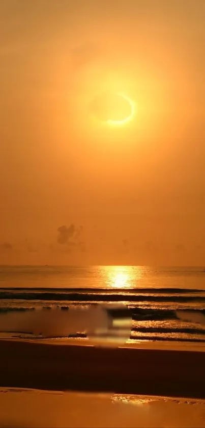 Golden sunset over a calm ocean with reflecting light.