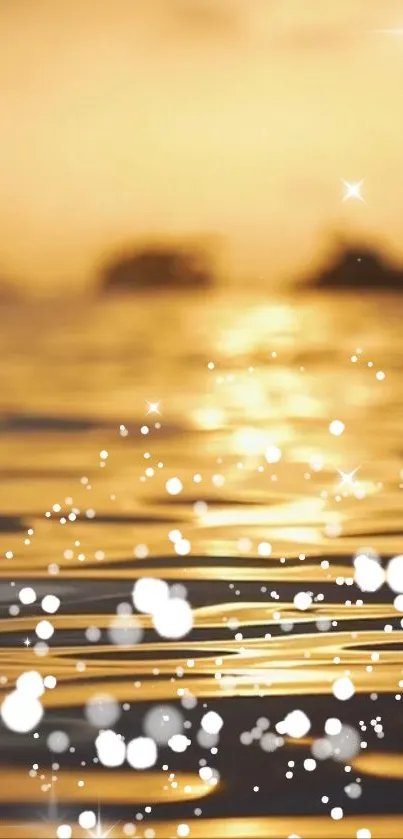 Golden sunset on water with white bokeh and star-like sparkles.