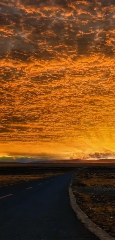 Open road at sunset with orange sky and dramatic clouds.