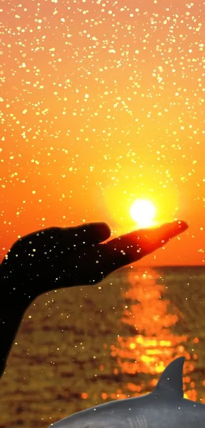 Silhouette hand holding sun with sparkles and dolphin