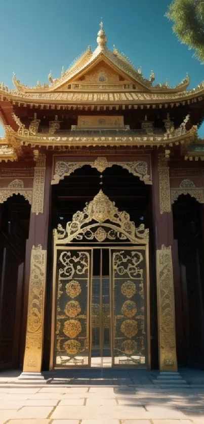 Golden ornate temple entrance with intricate design under blue sky.