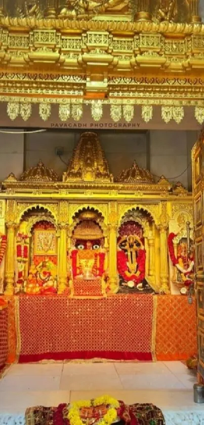 Intricate golden temple interior design with ornate decorations.