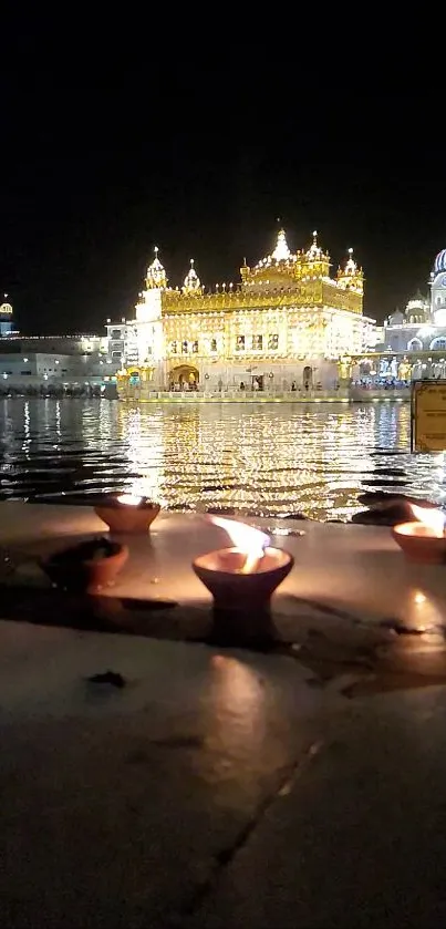 Golden Temple lit beautifully at night with reflections in water and glimmering diyas.