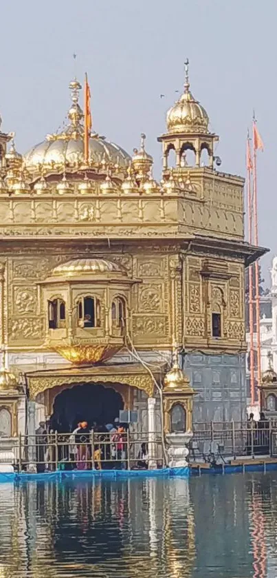 Golden Temple with serene water reflection and intricate architecture.