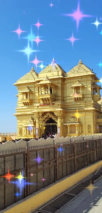 Golden temple under a vibrant blue sky, showcasing cultural architecture.