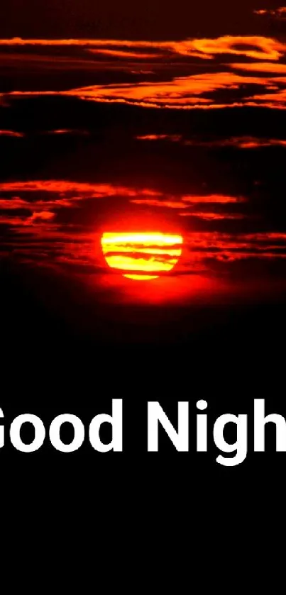 Orange sunset with dark clouds and 'Good Night' text on wallpaper.