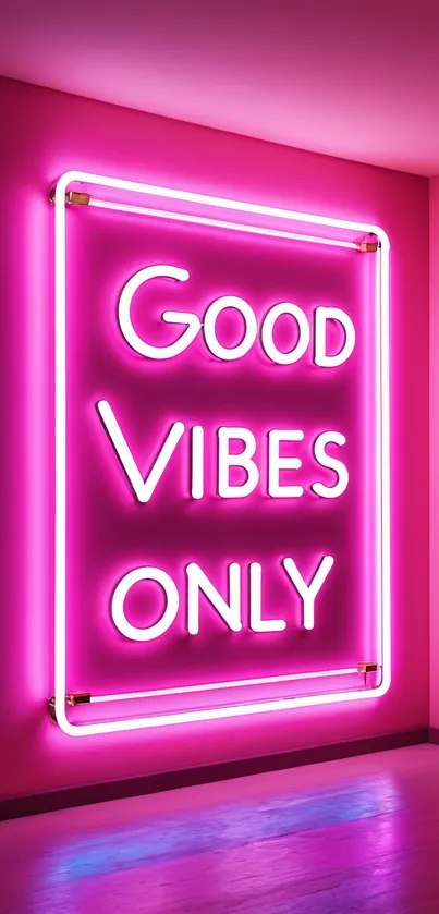 Pink neon sign reading 'Good Vibes Only' on a wall.