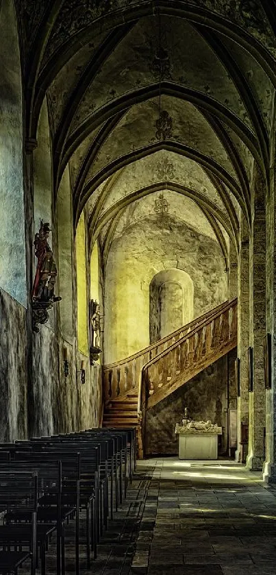 Gothic corridor with stone walls and dim lighting, featuring a wooden staircase.