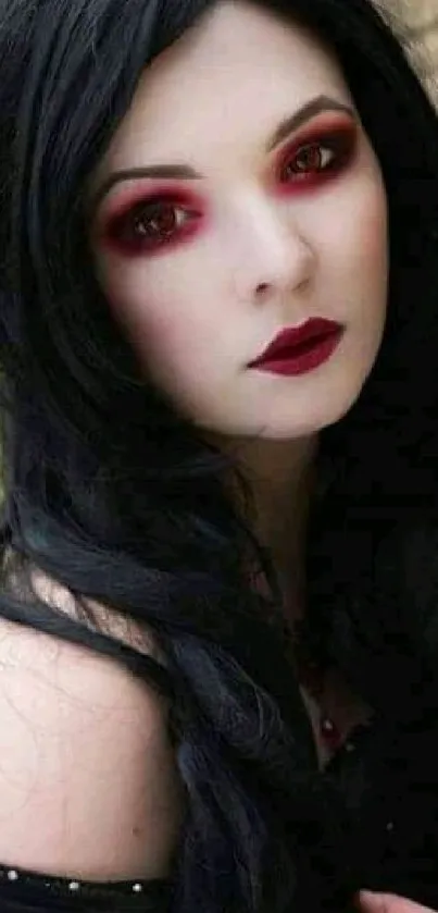 Gothic beauty with dark hair and dramatic makeup in a mobile wallpaper.