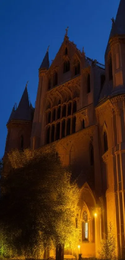 Gothic castle illuminated at twilight with dramatic architectural features.