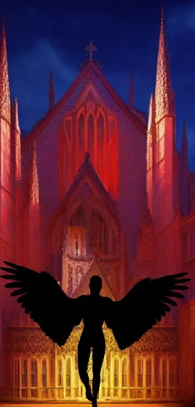Silhouette of an angel in front of a glowing Gothic cathedral at night.
