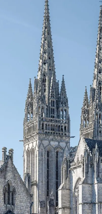 Gothic cathedral spires under a sky blue backdrop.