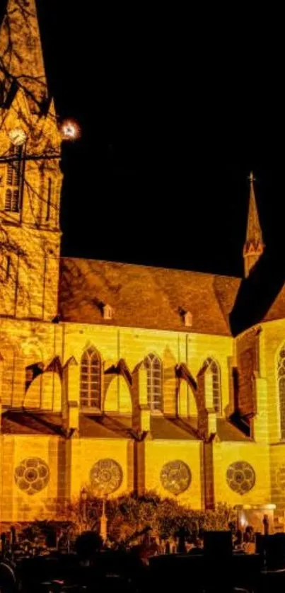 Illuminated Gothic church at night showcasing vibrant amber light.