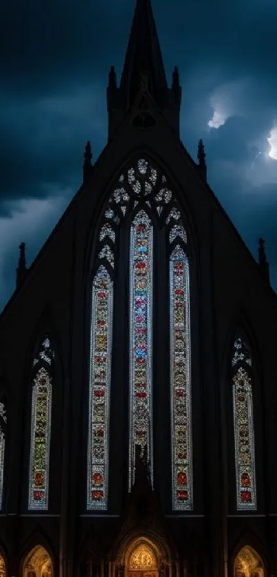 Gothic church with stained glass windows under a stormy night sky.