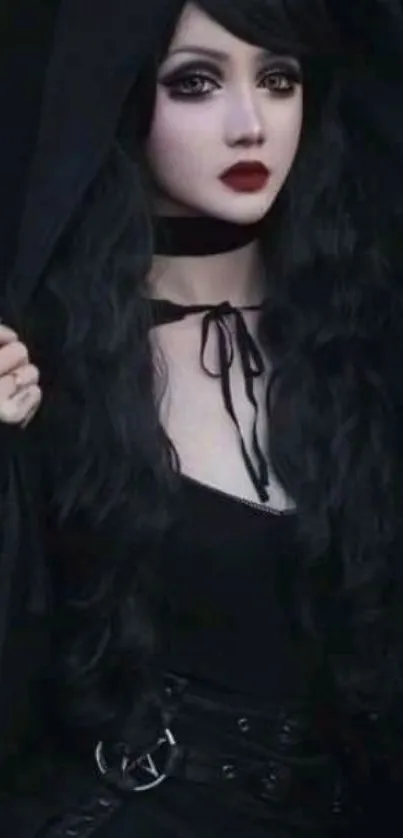 Gothic-inspired person in black attire with a hood on.