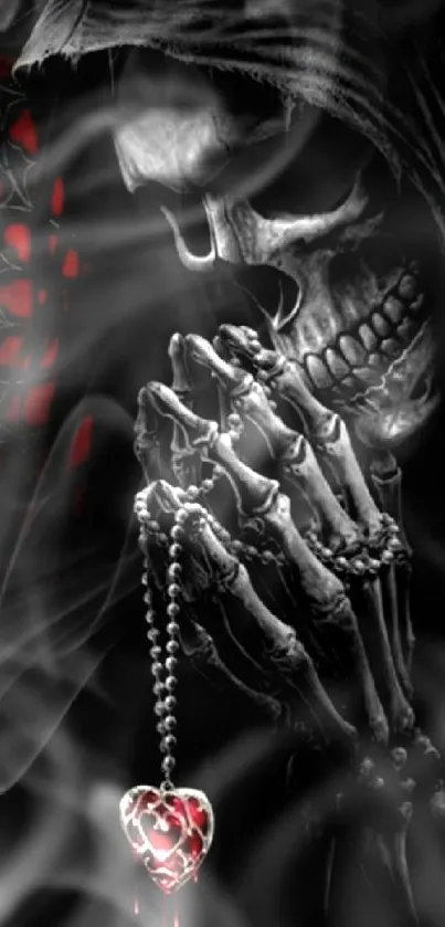 Gothic skull holding a rosary with heart pendant on dark background.