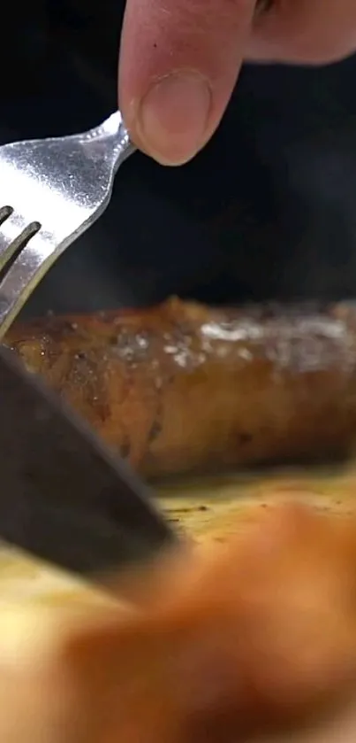 Close-up of a grilled sausage being sliced with a fork and knife.