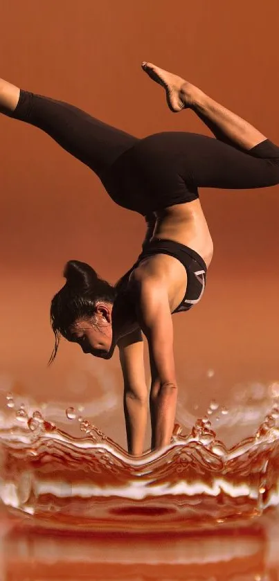 Acrobat performs handstand over water splash in dynamic wallpaper.