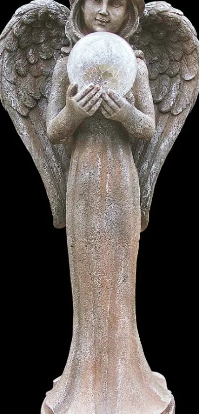 Elegant angel statue holding a sphere on a black background.