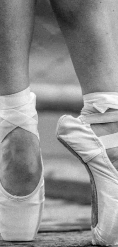 Black and white ballet dancer's pointe shoes on tiptoe.