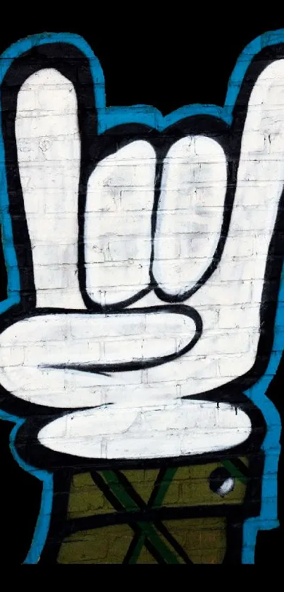 Graffiti hand sign on white brick wall with blue outline.