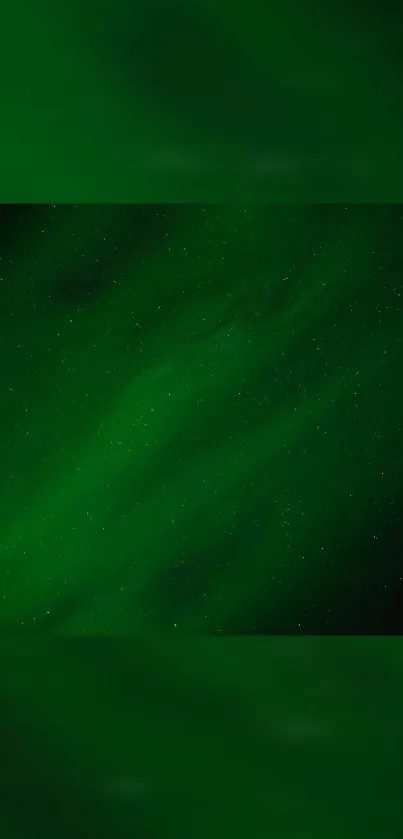 Green aurora borealis wallpaper with starry sky.