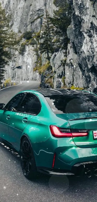 Green car driving on a mountainous road with rocky cliffs.