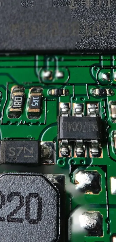 Close-up image of a green circuit board with detailed electronic components.