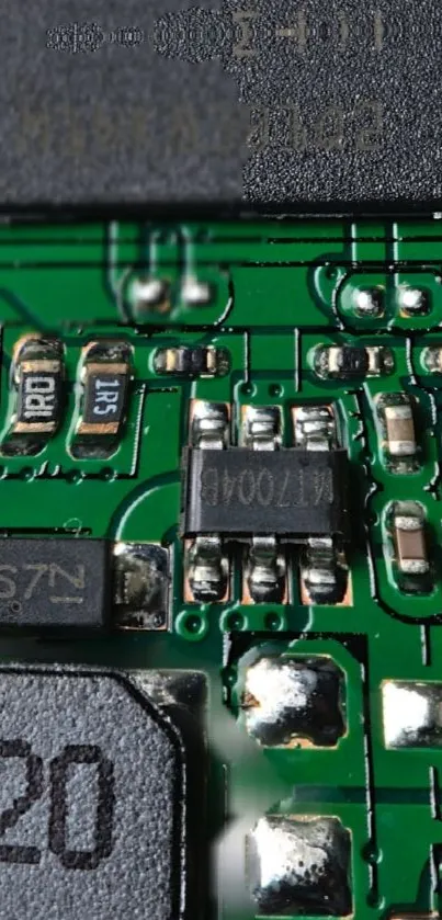 Close-up shot of a green circuit board with detailed electronic components.