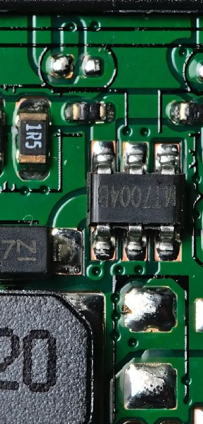 Close-up of a green circuit board with electronic components.