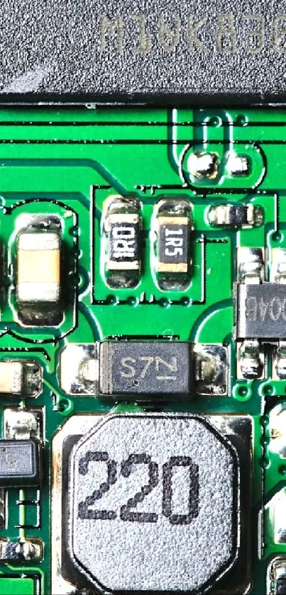 Green circuit board with detailed electronic components.