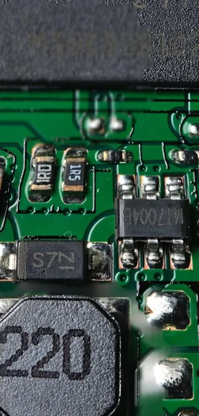 Close-up of a green circuit board with electronic components.