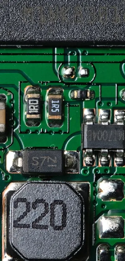 Close-up of green circuit board with electronic components.