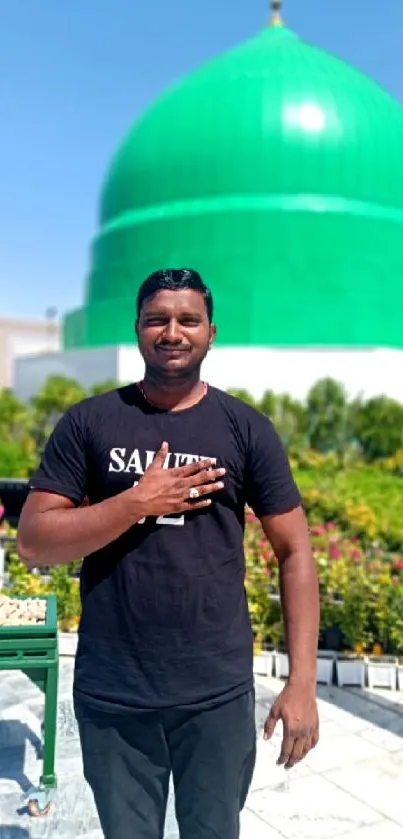 Green dome under a clear blue sky with person in foreground.