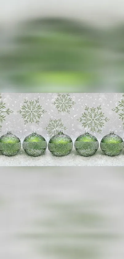 Green festive ornaments with snowflakes on a holiday-themed phone wallpaper.