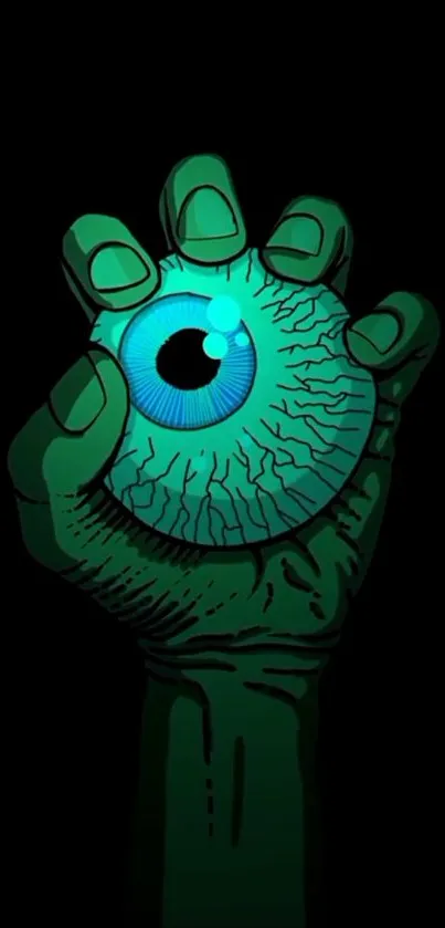 Green hand grips a blue eyeball on dark backdrop.