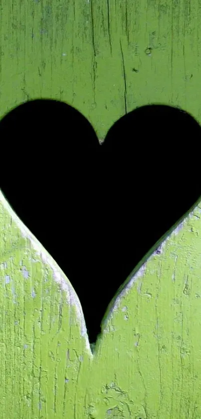 Green wood wallpaper with heart cutout.