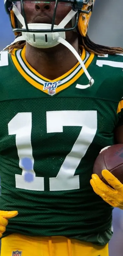 Action shot of football player in green and yellow jersey.