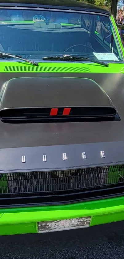 Front view of a green muscle car with black accents.