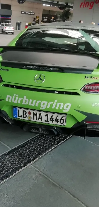 Green sports car parked at Nürburgring track.