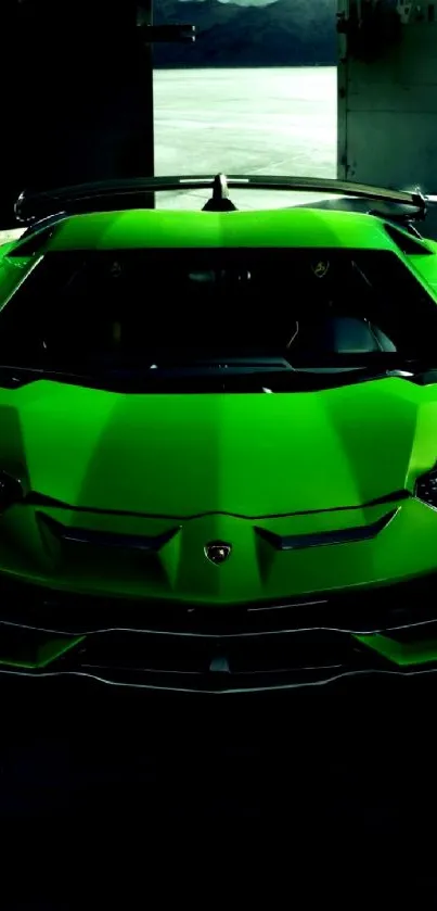 Sleek green sports car front view in garage.