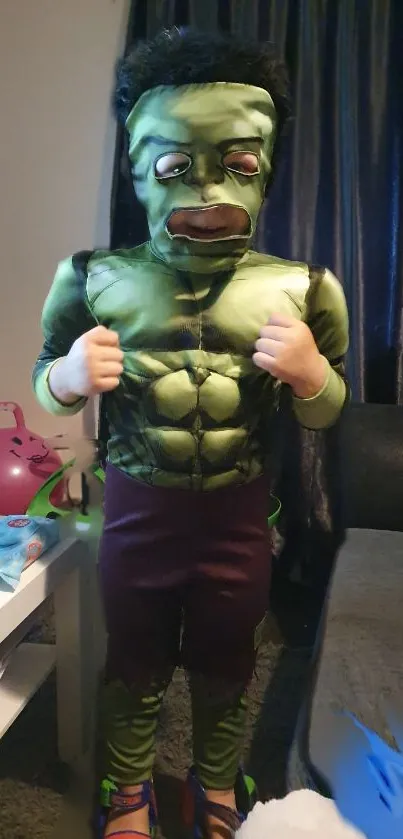 Child in a green superhero costume with vibrant colors.