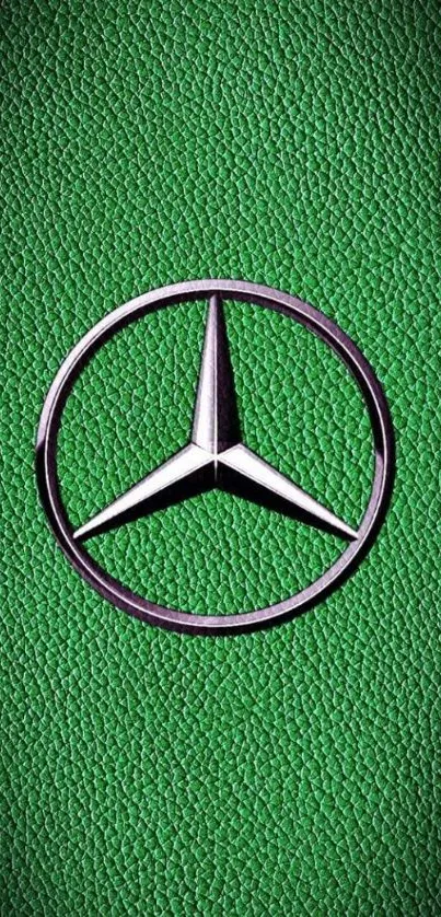 Green textured wallpaper with Mercedes logo.